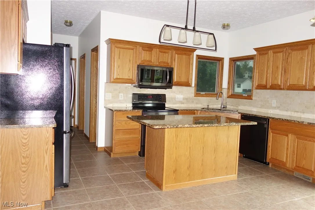 Lovely Granite countertops and a large Island