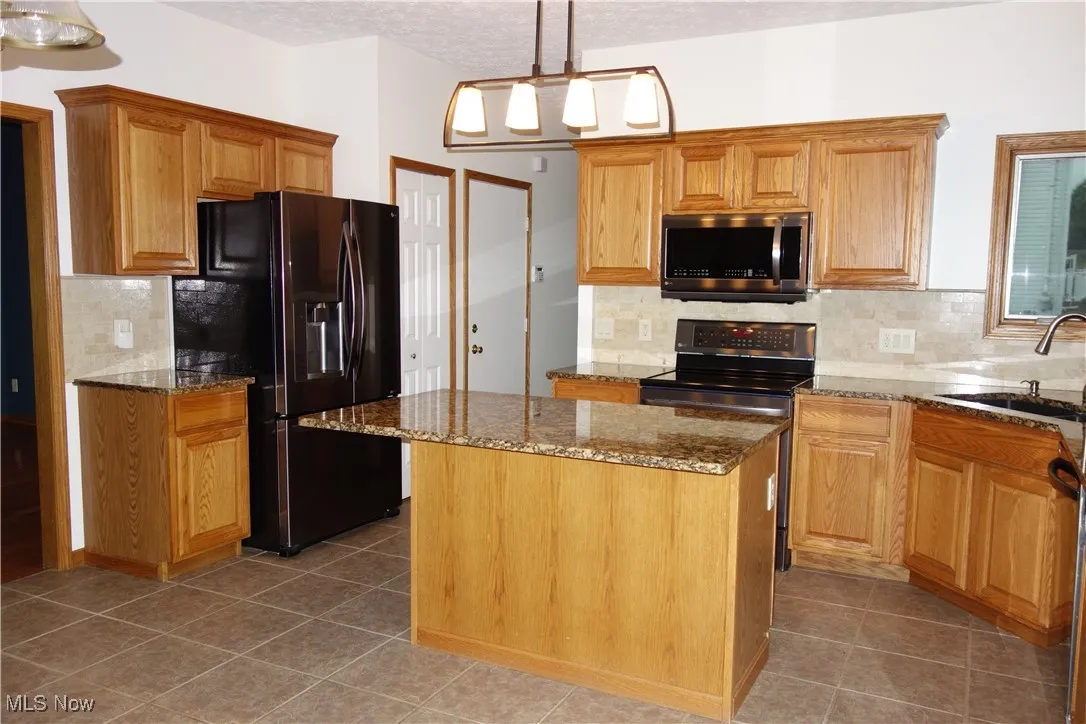 Lovely Granite countertops and a large Island