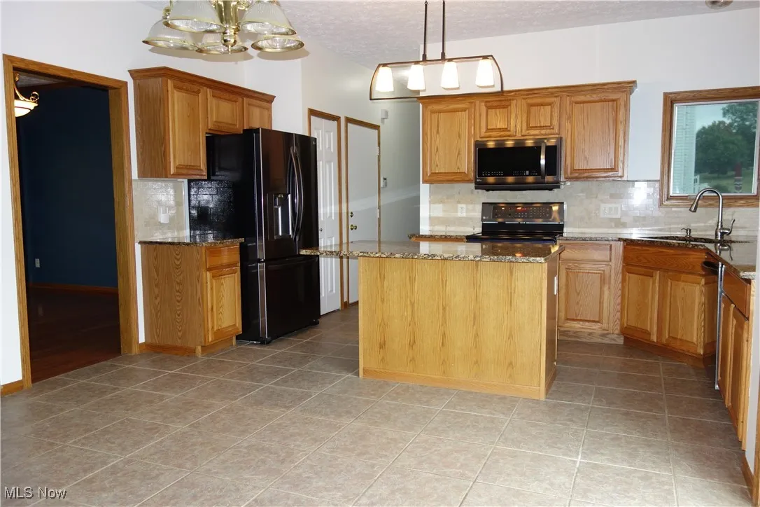 Oak Cabinetry and newer stainless appliances