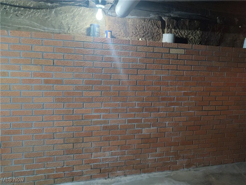 Additional brick wall inside the sand stone wall