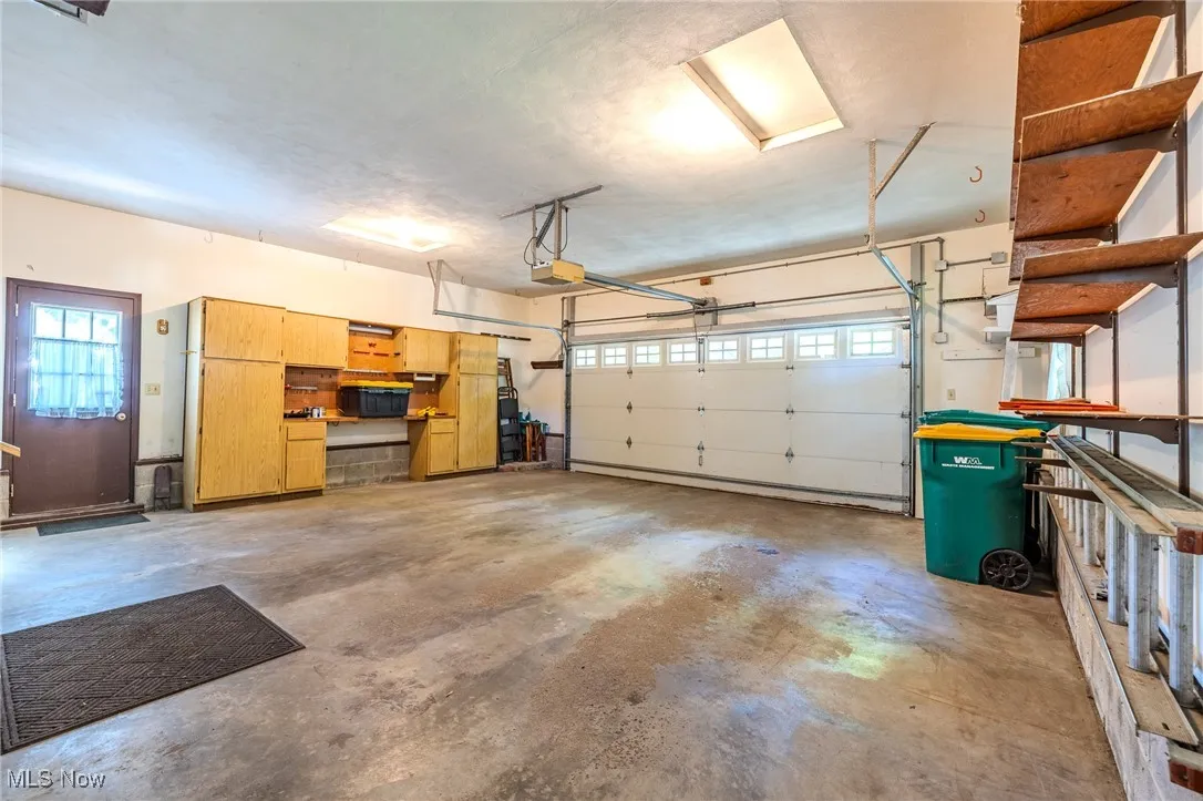 Garage featuring a garage door opener