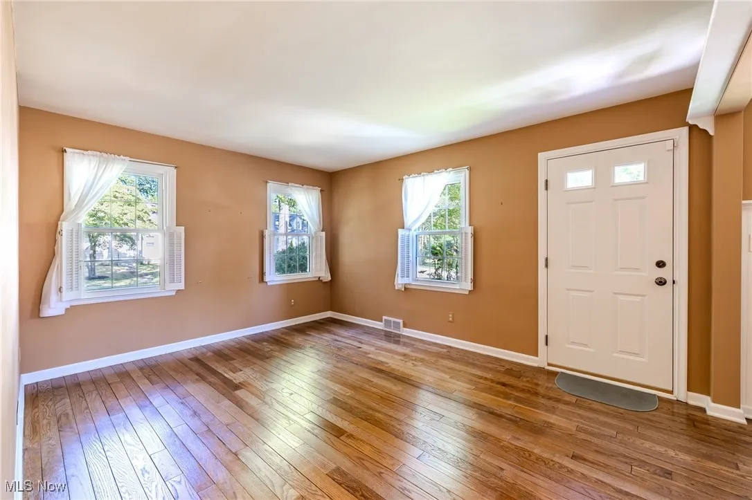 Formal Living Room featuring original wood flooring.