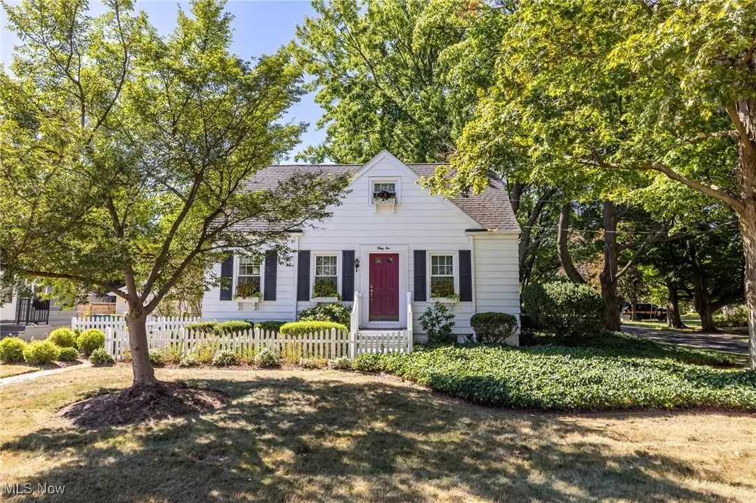 View of front of home featuring a shingled roof