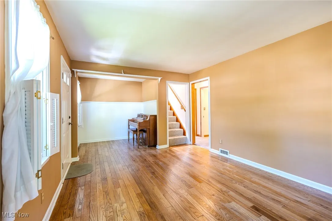 Formal Living Room featuring original wood flooring