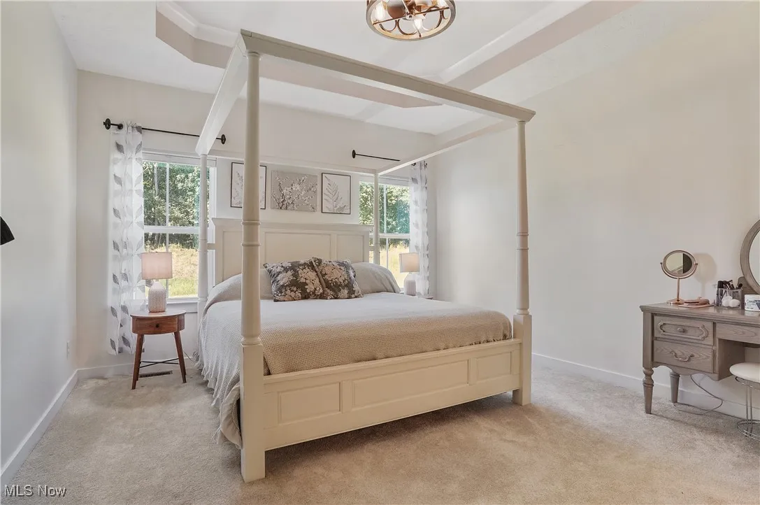 Bedroom with carpet floors and baseboards