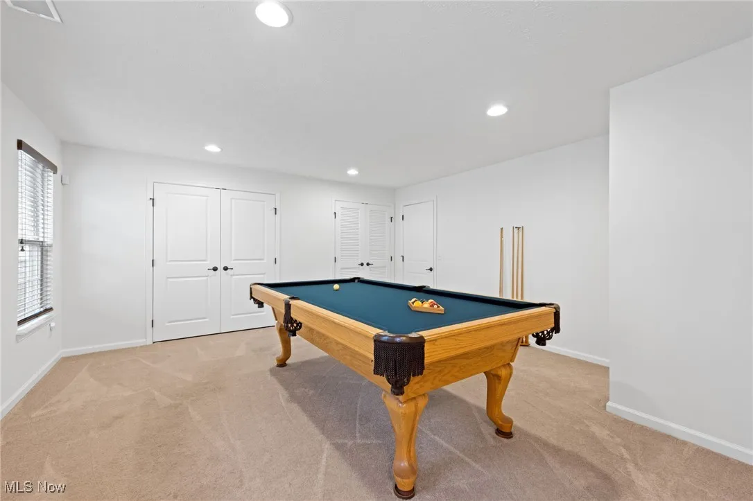 Rec room featuring light colored carpet, and recessed lighting