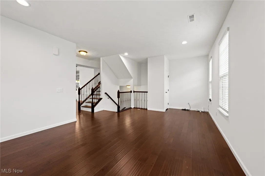 Living room featuring recessed lighting, and wood-type flooring