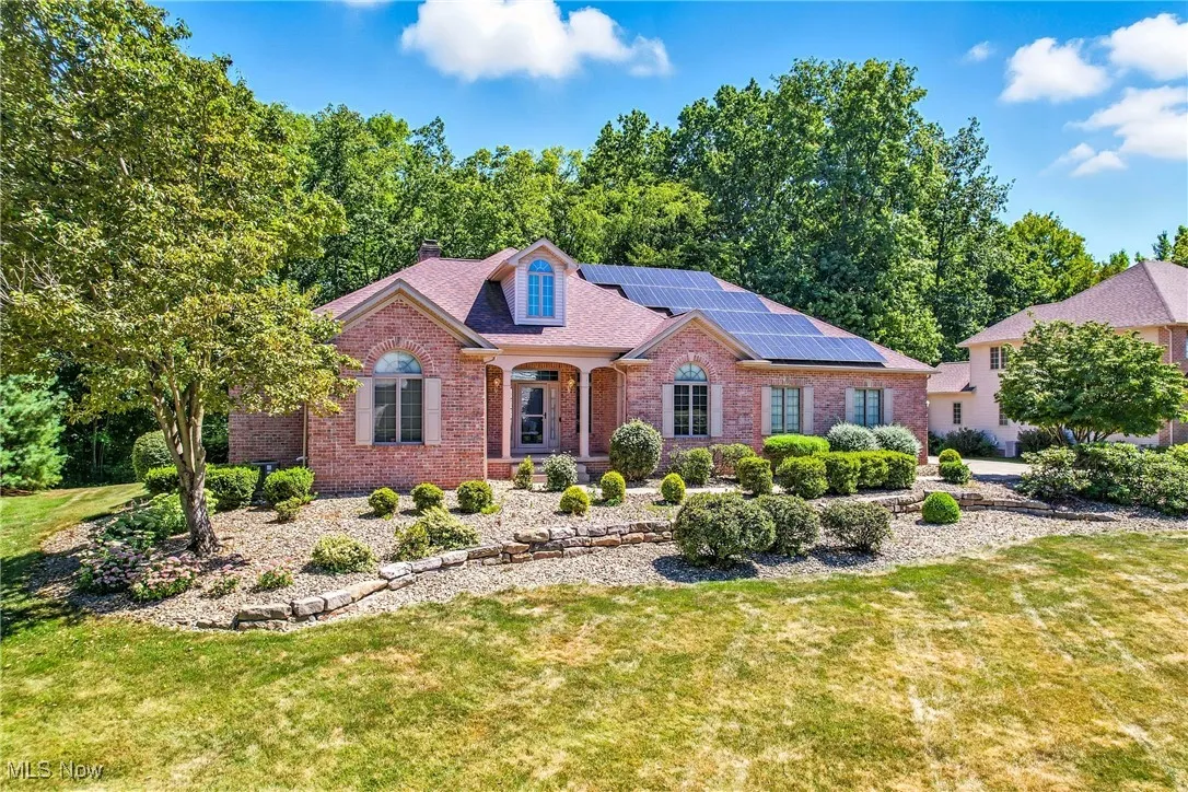 One of a kind expansive brick ranch w/ solar panels