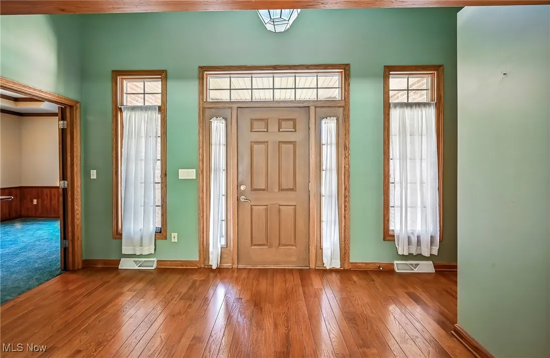 High ceiling, wood flooring, designated office