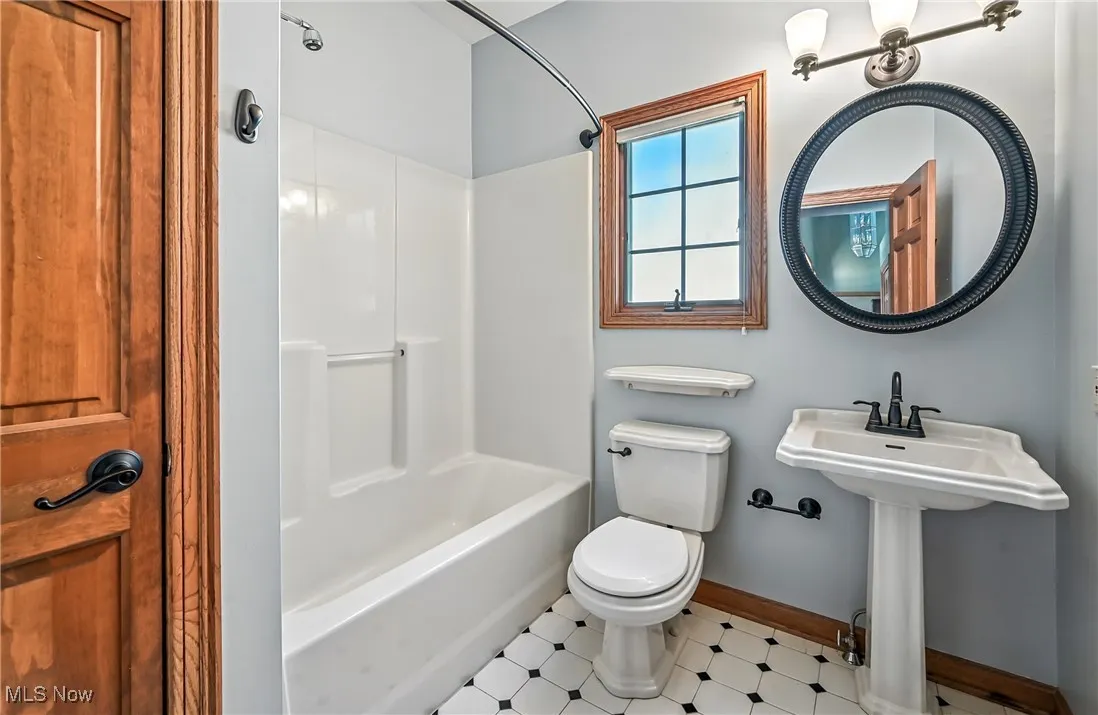 Full bath featuring tub / shower combination