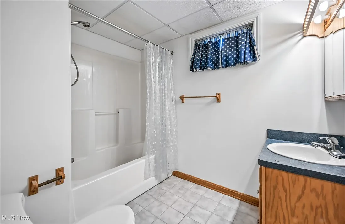 Bathroom with shower / tub combo, basement