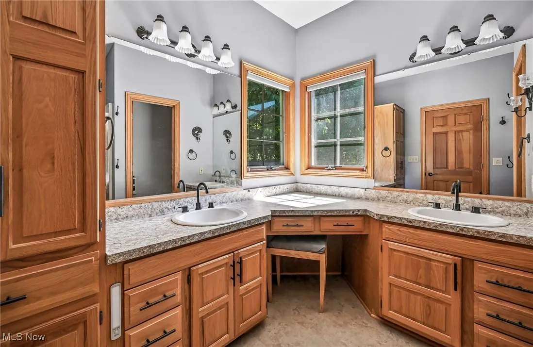 Full bathroom with double vanity, soaking tub & step in shower