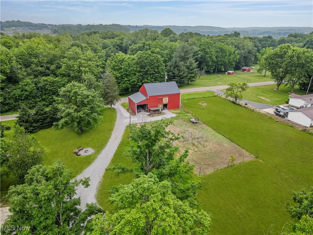 View from above of property with a forest