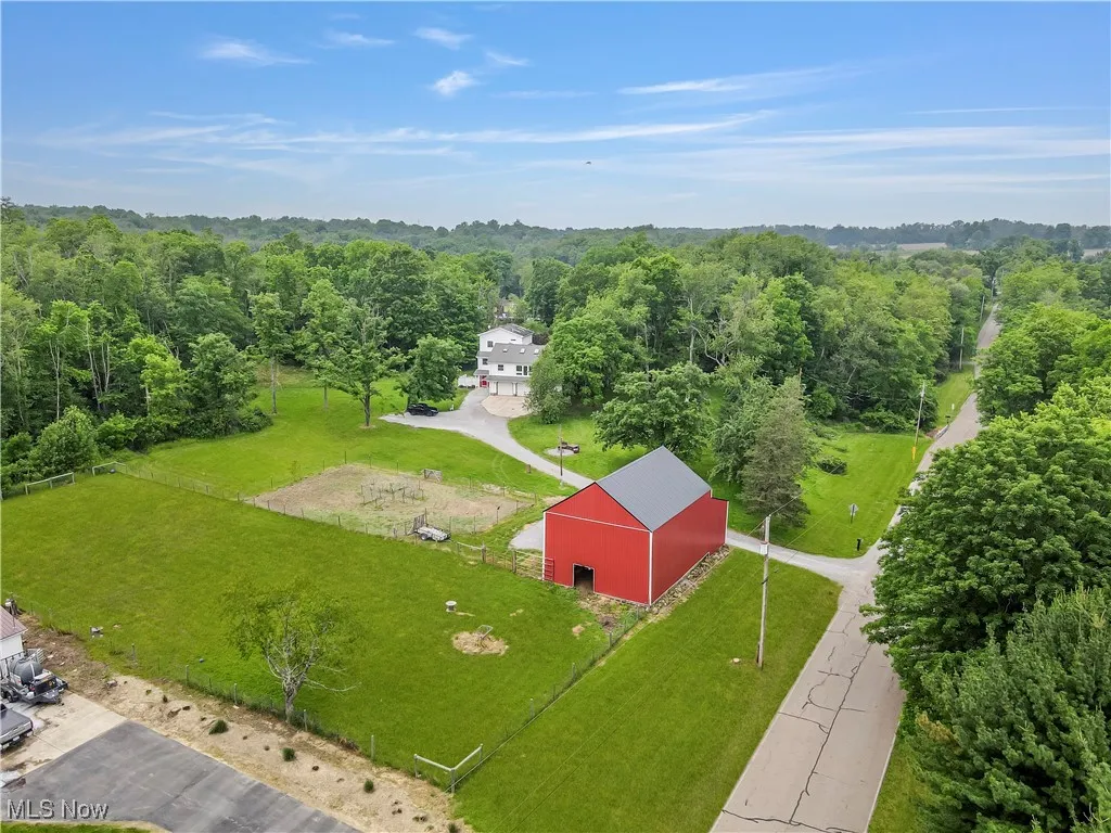 View from above of property with a forest