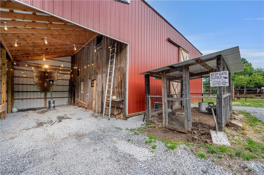 View of side of property with an outbuilding