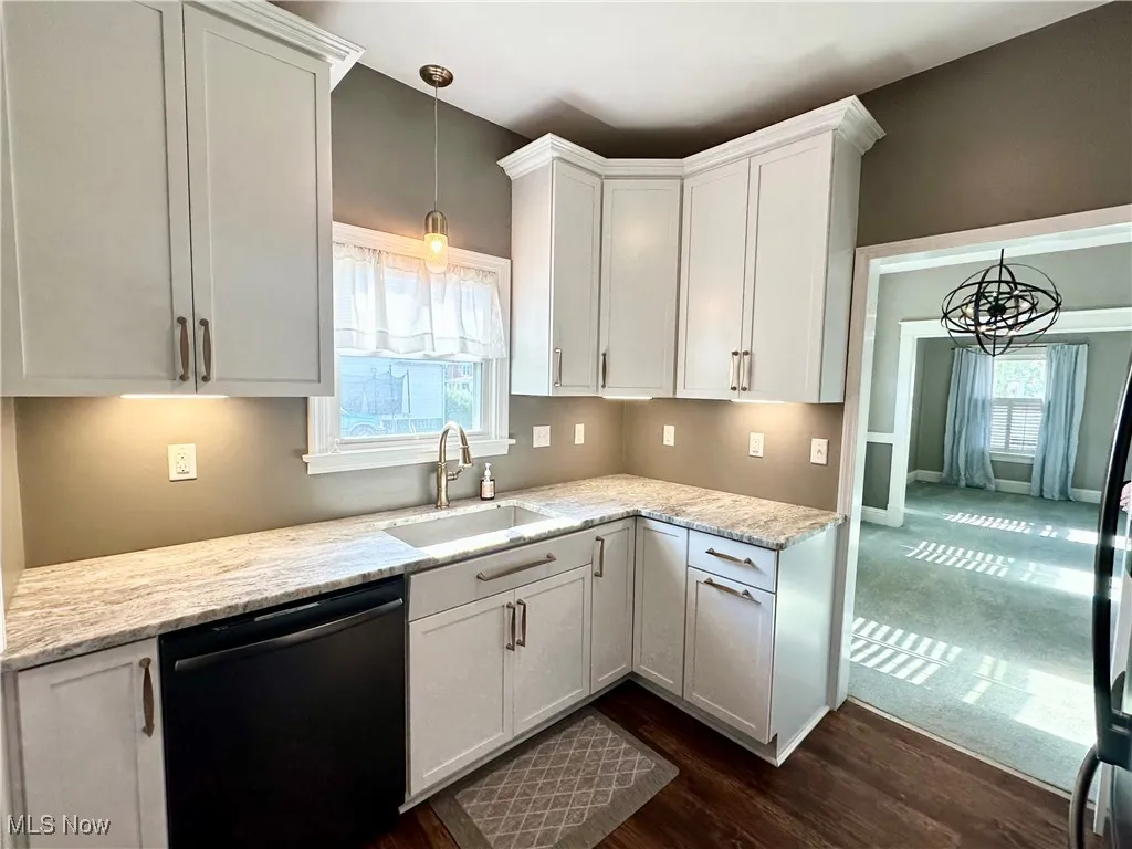 Kitchen featuring plenty of natural light, sink, and wood-style floors