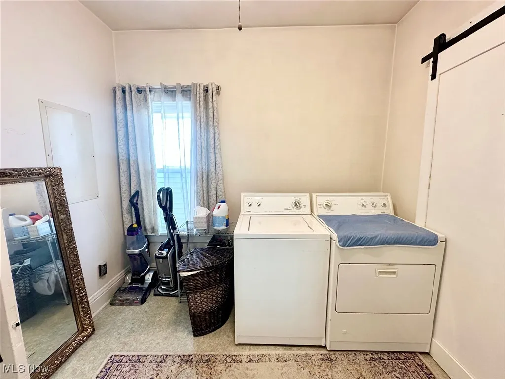 Laundry room featuring a washer and clothes dryer