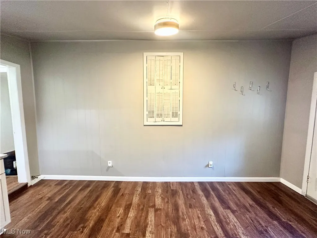 Family room with wood-type flooring