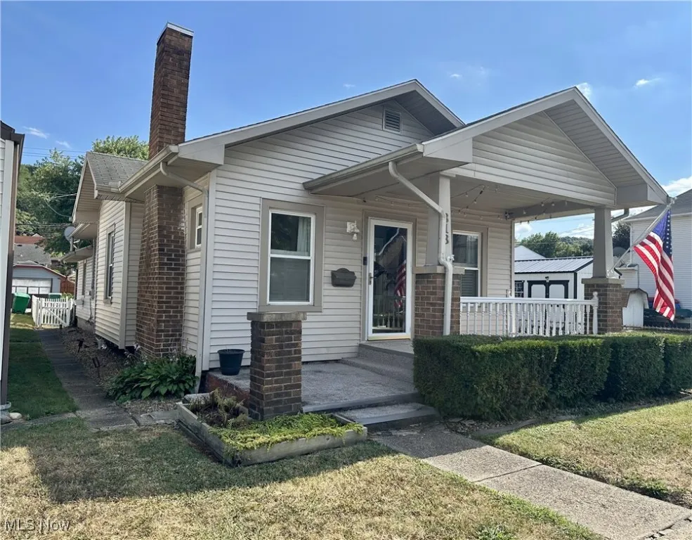 Front view of home featuring a covered porch