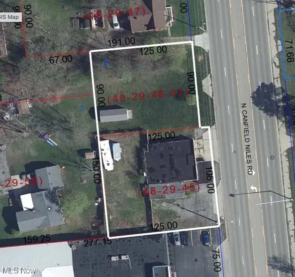 Aerial map of property and surrounding area featuring property parcel outlined
