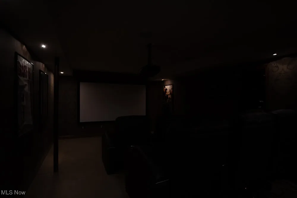 Cinema with recessed lighting and baseboards