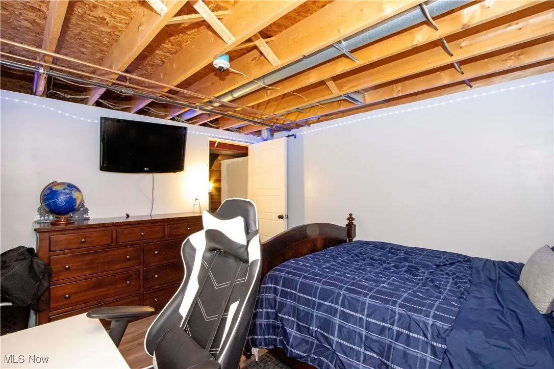 Bedroom with wood finished floors