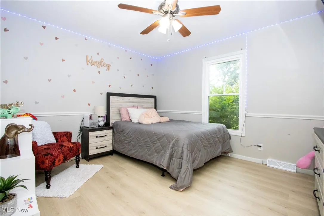 Bedroom featuring light wood finished floors and a ceiling fan