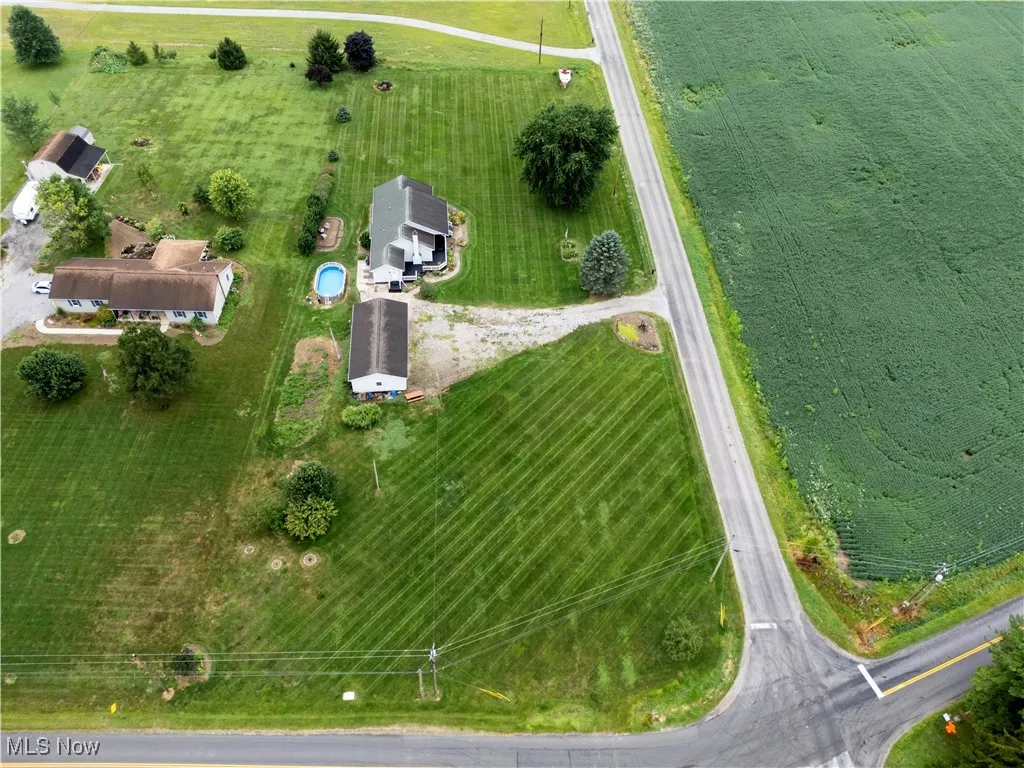 Aerial view of property's location featuring rural landscape and agricultural land