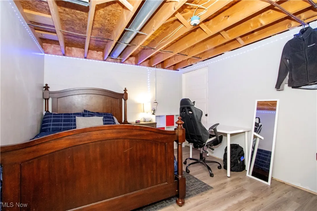 Bedroom with wood finished floors
