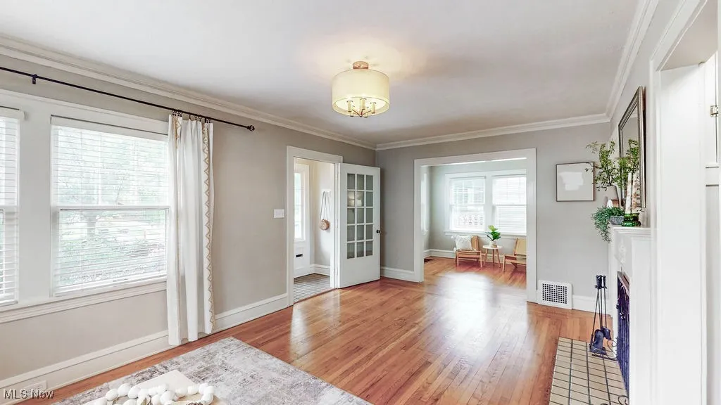 Additional view of living room looking into den.