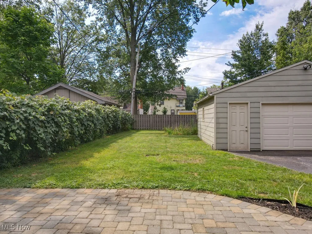 Patio, yard and detached garage.