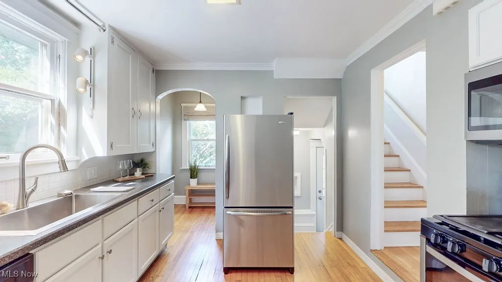 Kitchen featuring stainless steel appliances, hardwood floors and additional nook for eat-in or coffee bar.