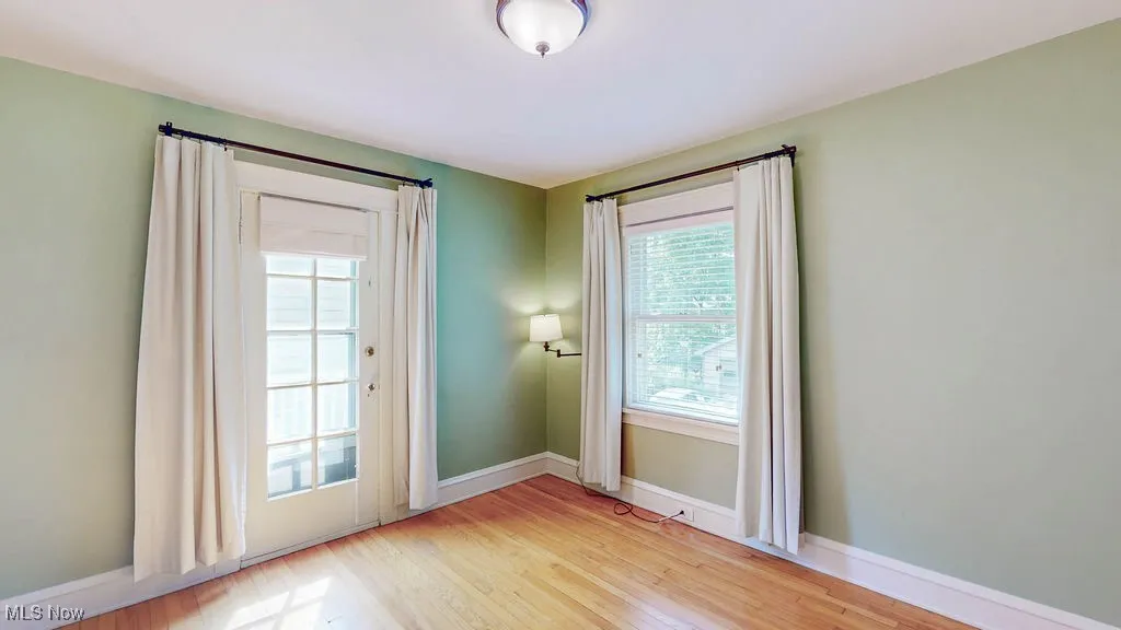 Second bedroom with door out to balcony.