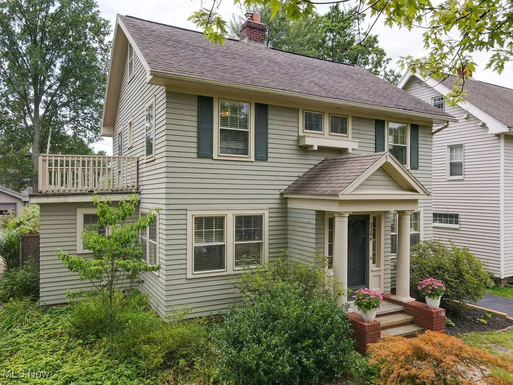 Additional view of front exterior featuring second floor balcony.