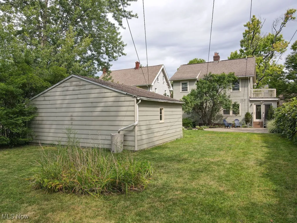 Additional view of backyard from the rear of garage.