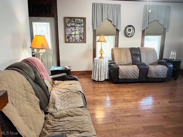 Living room with plenty of natural light and wood finished floors