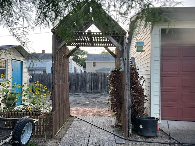View of patio / terrace with a garage