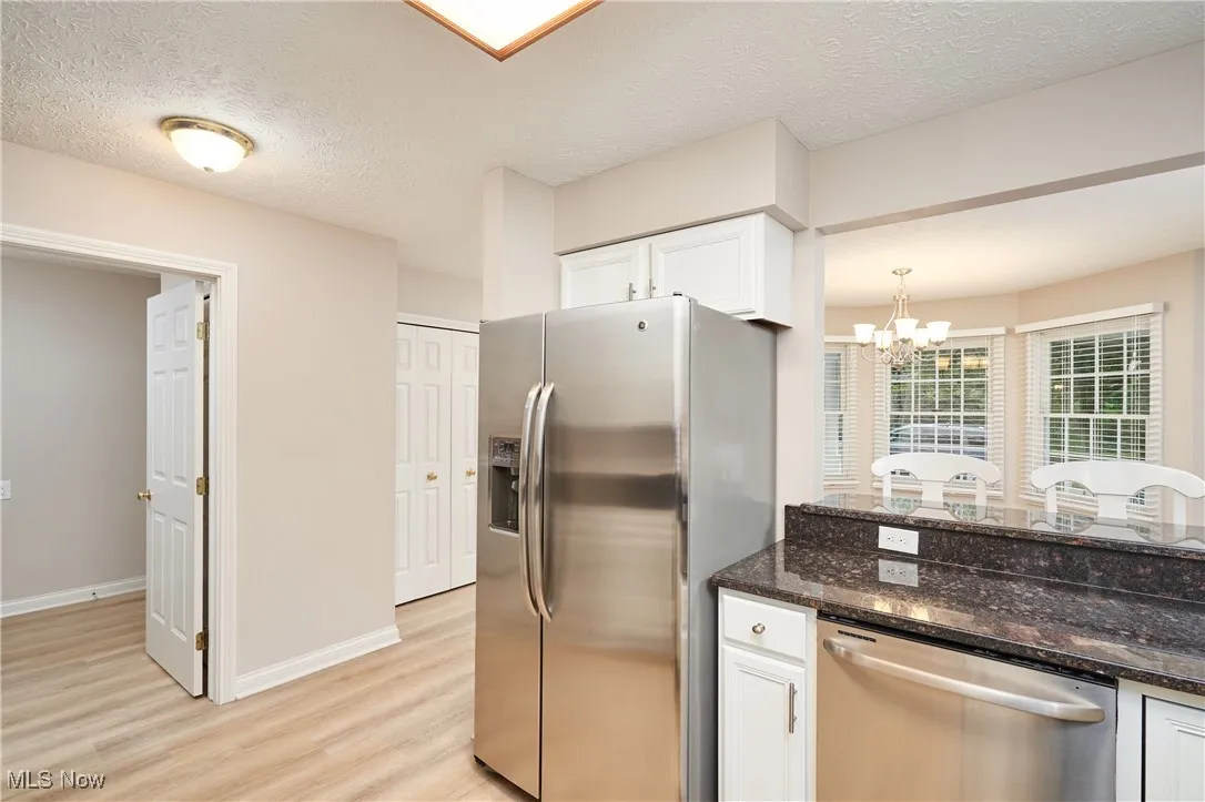 view from kitchen to dining area; room on left is the laundry room