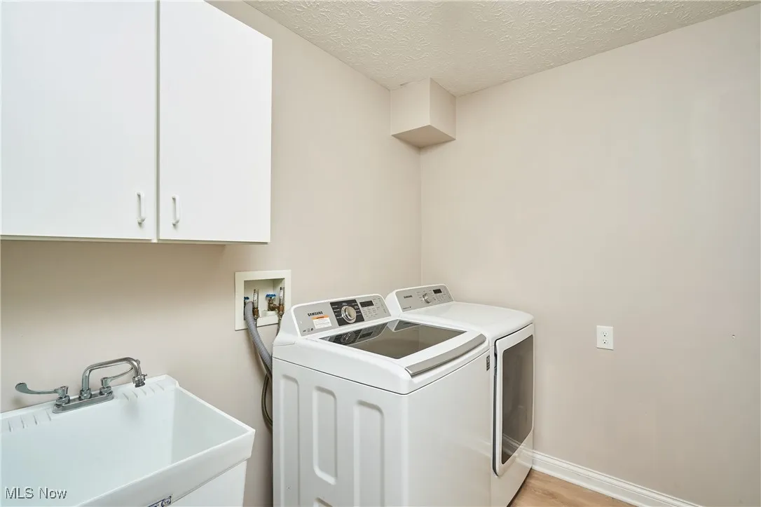laundry room with utility sink