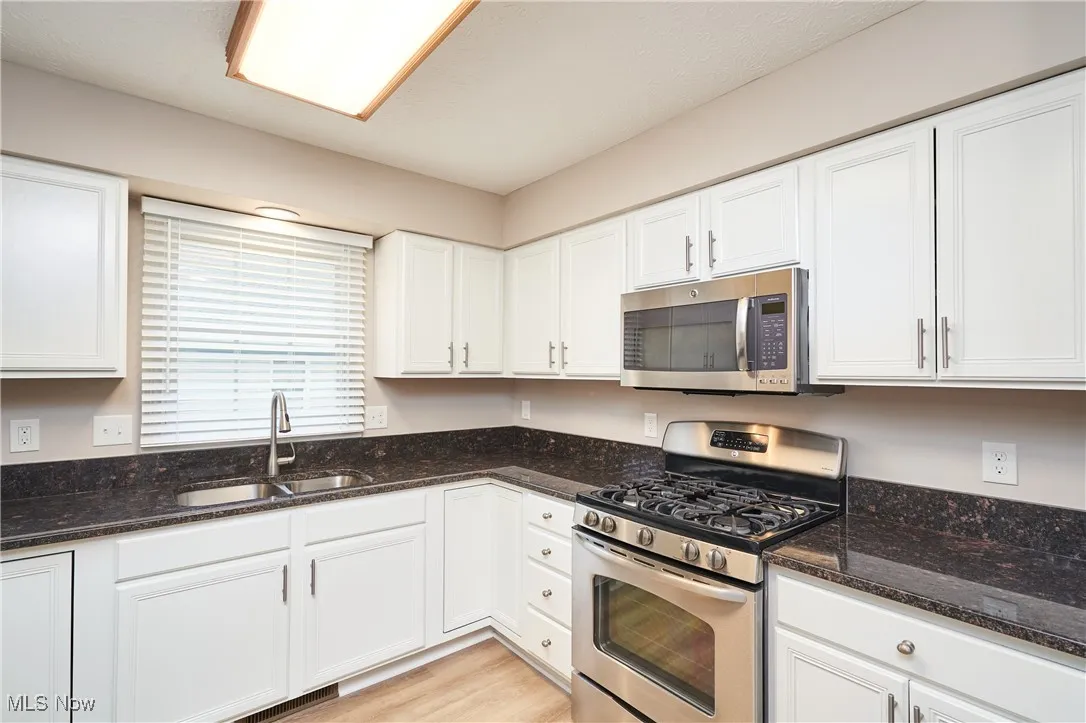 Kitchen with granite countertops and stainless steel appliances