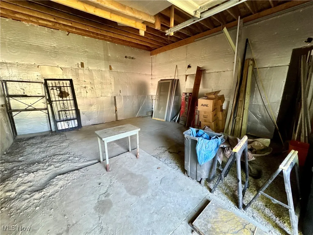 Miscellaneous room with unfinished concrete flooring