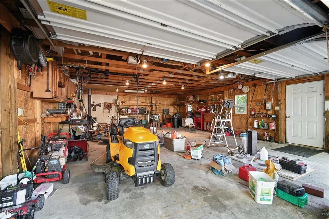 Interior of the detached garage with 16x10 shed attached in the back