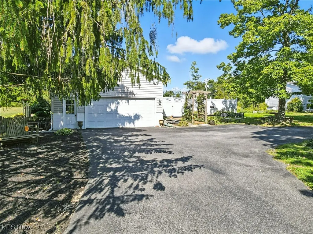 Paved drive to the 2 car attached garage