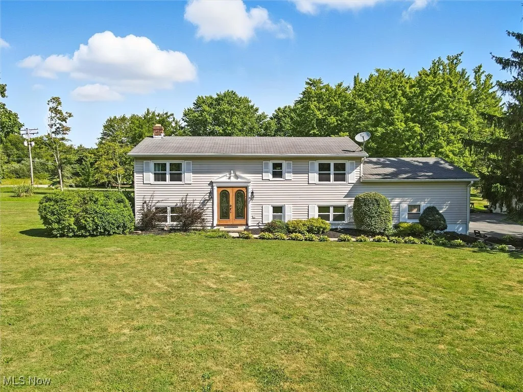Inviting double front door into the ceramic tiled foyer