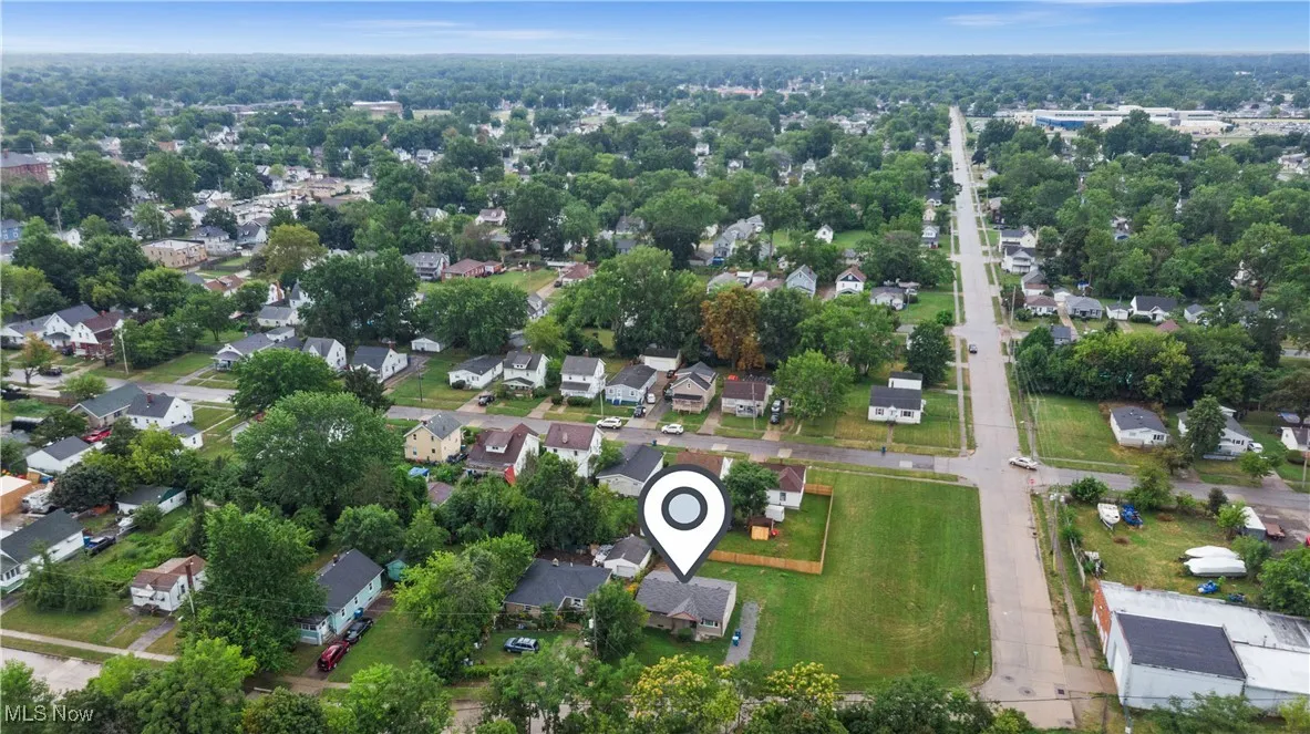 Aerial overview of property's location featuring nearby suburban area