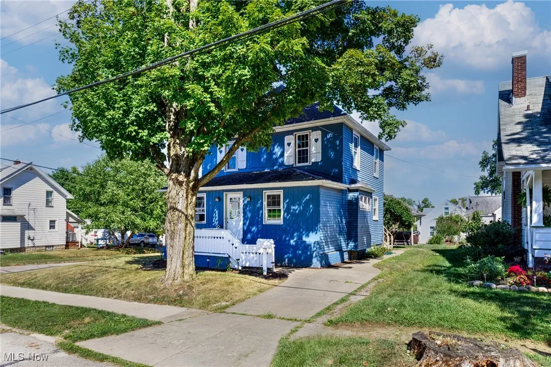 Traditional style home featuring a front yard
