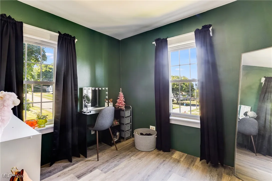 Home office featuring wood finished floors