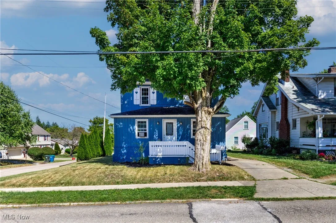 Bungalow with a front lawn