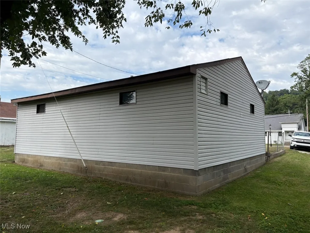 View of home's exterior with a lawn