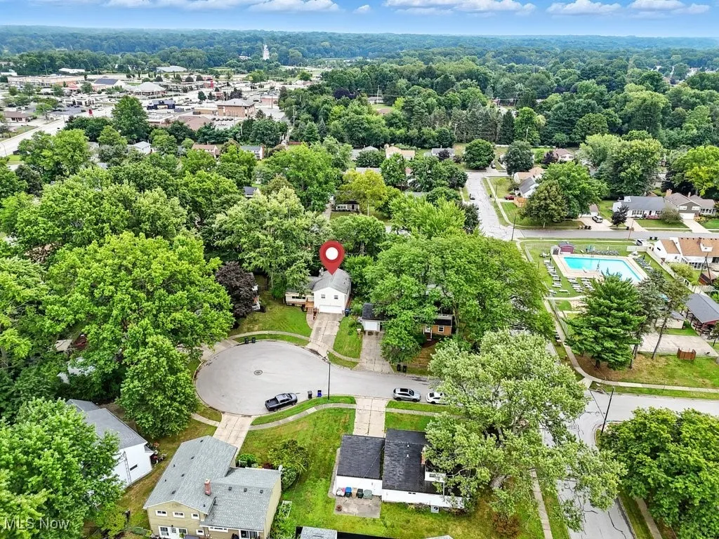 Aerial view of residential area featuring a pool area